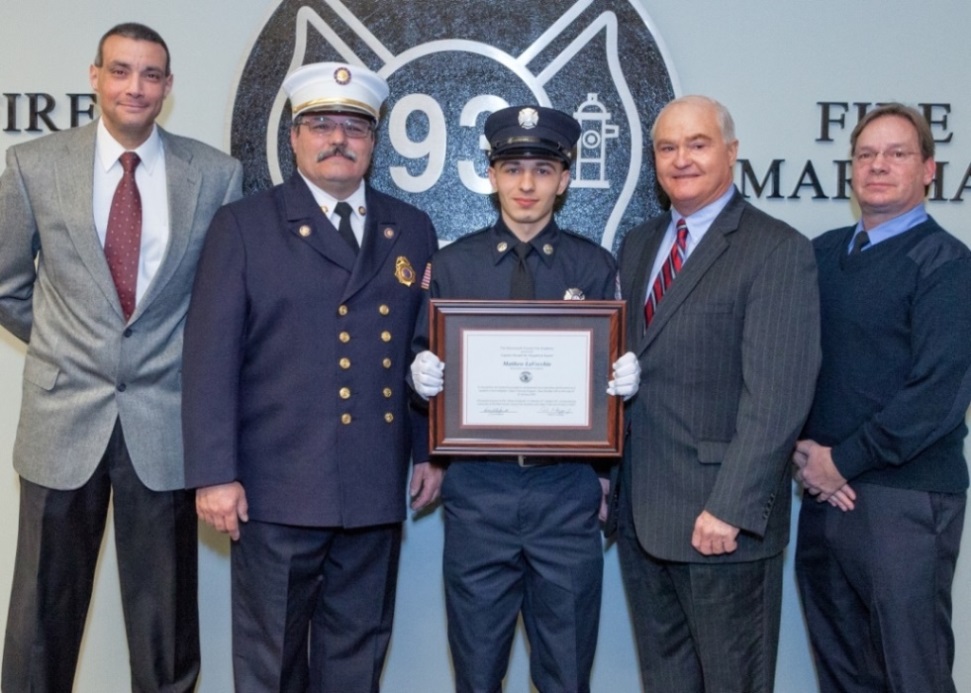 Matthew LaVecchia of Gordon’s Corner Fire Company in Manalapan is presented with the Class 104 Ronald Fitzpatrick Firefighter 1 Award at the Monmouth County Fire Academy graduation on Jan. 21, 2015 in Howell, NJ. Pictured left to right:  Fire Academy Director Armand Guzzi, Monmouth County Fire Marshal Henry Stryker III, Matthew LaVecchia Freeholder John P. Curley and Steve Fitzpatrick.